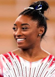 simone biles piercings.